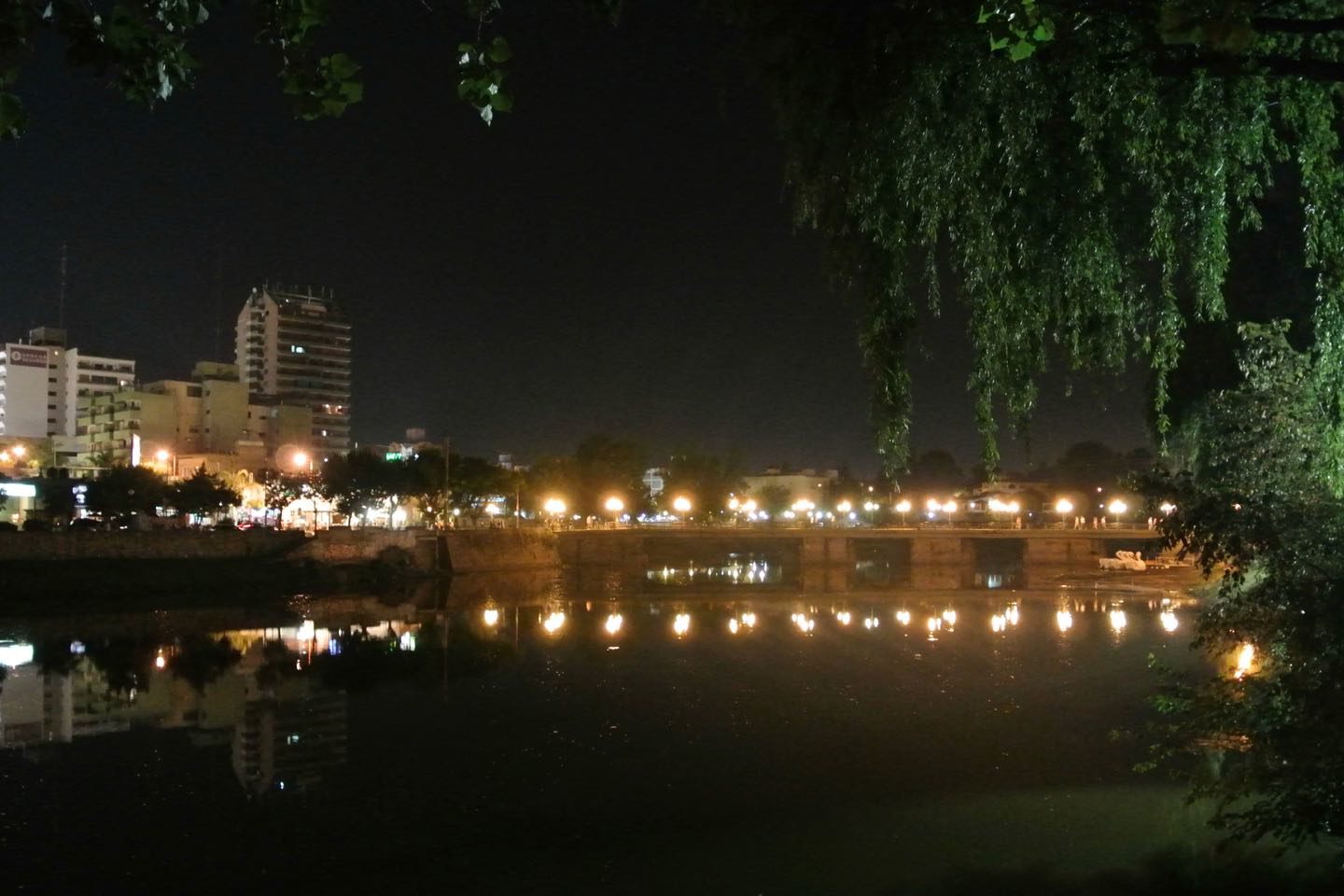 San Roque Lake at night with one of its lighted bridges.