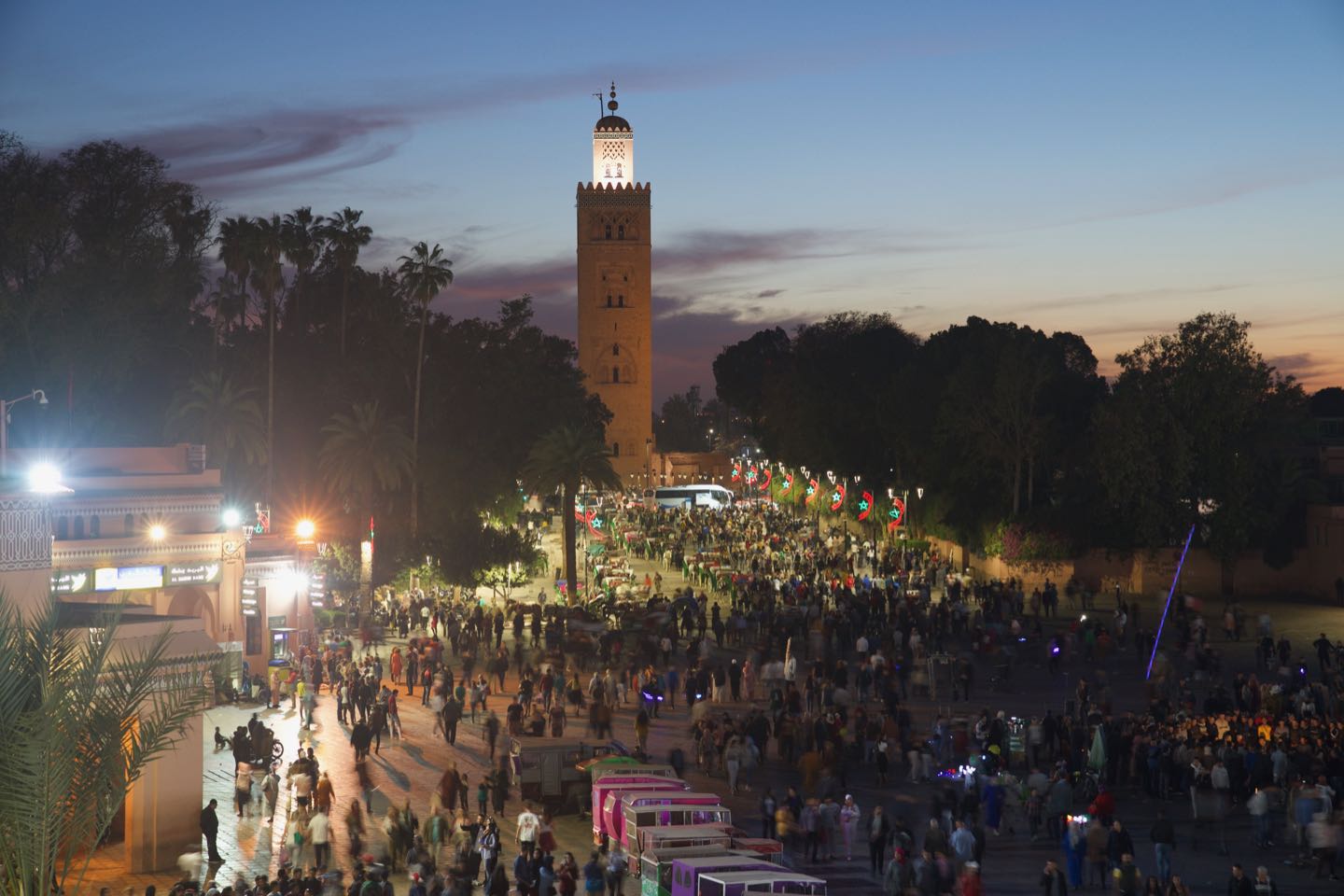 Panoramic view of the Koutoubia Mosque from Le Grand Balcon du Café Glacier at night time.